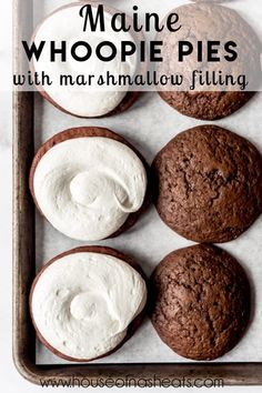 chocolate cookies with marshmallow filling are on a baking sheet and the words, maine whoopie pies with marmallow filling