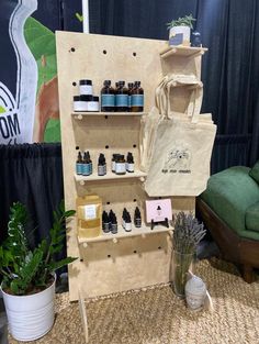 a display case filled with lots of different types of bottles next to a green chair