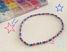 a beaded bracelet with star shaped beads and stars on the side next to it