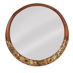 a round mirror with an ornate design on it