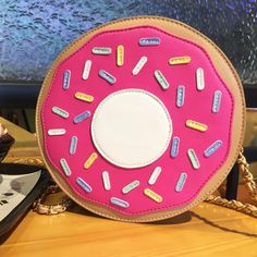 Fun bag Available in two pink color choices Donut Bag, Bag Light, Zipper Top, Cosmetic Pouch, Poker Table, Fun Bags, Types Of Fashion Styles, Color Choices, Donuts