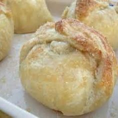 several pastries sitting on top of a white plate