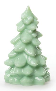 a small green ceramic christmas tree on a white background