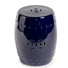 a blue ceramic stool with holes in the middle