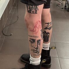 a person with tattoos on their legs and feet