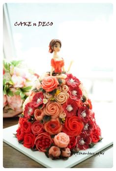 a cake decorated with flowers on top of a table