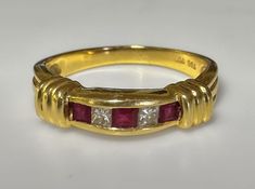 Retro/Contemporary c1980s Very well made, solid Ruby Diamond Ring. Little bit of a Deco feel. Perfect stacker ring. 4.3g 18k solid yellow gold Three Red Ruby .20ct Two Diamond accents S 7.5 US resizable  Fine vintage condition Yellow Gold Ruby Ring With Channel Setting For Anniversary, Anniversary Yellow Gold Ruby Ring Channel Set, Anniversary Ruby Ring In Yellow Gold With Channel Set, Gold Ruby Ring Channel Set For Anniversary, Formal Gold Ruby Ring With Vvs Clarity, Retro Contemporary, Ruby Diamond Ring, Stacker Rings, Signet Ring Men