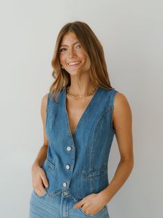 Embrace western flair in the "Nicolette Denim Vest!" A versatile option for wearing with any jeans or skirts, this vest is both versatile and elevated! It features a medium wash color, v-neckline, sleeveless sides, and button front. This vest is a piece that you will turn to again and again this fall! Detailed Fit: V-neck denim vest 3 button up closure Overall Fit: Fitted with no stretch Sizing: True to size Fabric: 85% cotton, 15% polyester Care: Hand wash cold, do not bleach, line dry, low iro Again And Again, Denim Vest, Overalls, Bleach, Button Up, Hand Wash, Turn Ons, Fabric, How To Wear