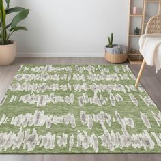 a green rug with white letters on it in front of a chair and potted plant