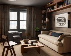 a living room filled with furniture next to a window and bookshelf on the wall