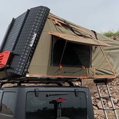 the roof tent on top of a jeep