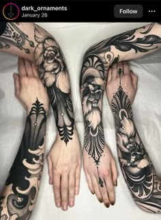 three people with tattoos on their arms and hands, both holding each other's hands