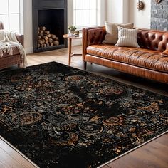 a living room filled with furniture and a rug on top of a hard wood floor