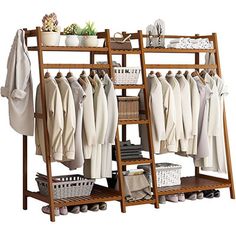 a wooden rack with clothes hanging on it