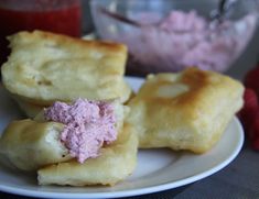 some food on a white plate with strawberries