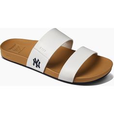 Enjoy a fun day under the sun in these Cushion Vista sandals from REEF. Designed with subtle yet striking New York Yankees details, these slides are perfect for poolside fun or game day festivities. The contoured footbed maximizes comfort, helping you feel your best as you rep the New York Yankees.Enjoy a fun day under the sun in these Cushion Vista sandals from REEF. Designed with subtle yet striking New York Yankees details, these slides are perfect for poolside fun or game day festivities. Th Adjustable Summer Sport Sandals, Sporty Synthetic Sandals For Summer, Synthetic Slide Flip Flops For Summer, Sporty Slides For Swimming In Summer, Sporty Slides For Summer Swimming, Synthetic Slides For Beach In Summer, Summer Synthetic Flip Flops For Poolside, Summer Sport Sandals For Vacation, Vacation Flip Flops With Open Toe, Synthetic