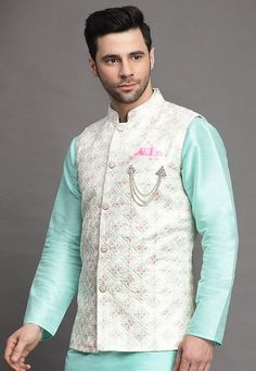 Art Silk Nehru Jacket in Off WhiteThis Readymade Sleeveless attire is Enhanced with Buttons and Resham Work. Crafted in Chinese Collar NeckDo note: Brooch and Kurta shown in the image is for presentation purposes only. Half to one inch may vary in measurement. (Slight variation in actual color vs. image is possible) Mens Kurta | Mens Kurta Pajama | Mens Sherwani | Mens Sherwani Sets | Traditional Menswear | Partywear Menswear | Indian Mens Dresses | Diwali Kurta | Kurta Pajama | Bollywood Menswe Luxury White Nehru Jacket For Traditional Ceremonies, Luxury Off-white Nehru Jacket For Men, White Embroidered Nehru Jacket For Spring, White Embroidered Bandhgala For Spring, Spring White Embroidered Nehru Jacket, Spring Embroidered White Nehru Jacket, White Nehru Jacket With Resham Embroidery For Spring, White Resham Embroidery Nehru Jacket For Spring, White Embroidered Sleeveless Traditional Wear