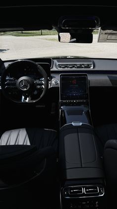 the interior of a car with black leather seats and steering wheel, dashboard, and dash board