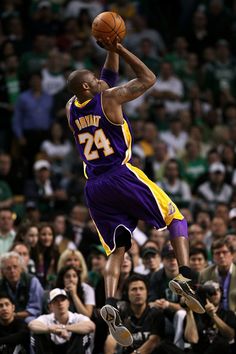 an image of a basketball player in the air with fire coming out of his hands