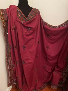 "Brand new without tags Balochi fully hand embroidered with mirror work Full size chaddar dupatta Size:92\"x 52\" inches  Color:Maroon Fabric:Cotton Silk ❌No Return Or Exchange❌ ➡️Feel free to message us if you need more pictures, measurements and details about the dress." Festive Churidar With Dabka Work, Red Resham Embroidered Shantoon Dupatta, Red Shantoon Dupatta With Resham Embroidery, Resham Embroidered Shantoon Dupatta For Navratri, Shantoon Dupatta With Dabka Work In Traditional Drape, Festive Salwar Kameez With Mirror Work In Nida Fabric, Unstitched Chinon Dupatta With Dabka Work, Red Nida Salwar Kameez With Mirror Work, Red Unstitched Suit With Mirror Work For Festivals