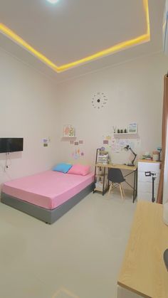 a room with a bed and desk in it