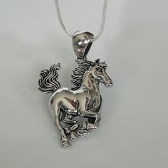 ▪︎ ONE sterling silver horse charm. ▪︎ Size: 27 X 37(Including hoop) mm Weight: 6.7 gm ▪︎ This multi purpose pendant can be used as a charm in necklaces, bracelets, key chains, zip pullers etc. ▪︎ This pendant is handmade with hypoallergenic sterling silver. Most of my pieces are marked with a 925 silver stamp. ▪︎ Please note: This listing is for ONE pendant and comes WITHOUT the chain, however, you can add a snake chain in the required length while making your selection. You can also opt to cho Yin Yang Charm, Horse Bracelet, Wanderlust Jewelry, Horse Pendant, Horse Necklace, Silver Horse, Horses Pendant, Silver Wings, Neck Jewellery