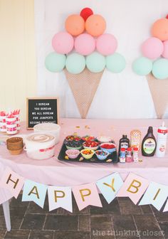 a birthday party with ice cream cones and balloons