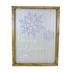 a wooden frame with a snowflake design on it and the words heaven and nature's gifts written in white ink