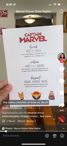 someone is holding up a menu for captain marvel in the movie avengers and iron man