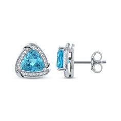 Blue never looked better than in these stud earrings. Crafted in sterling silver, each earring showcases a trillion-cut Swiss blue topaz wrapped in a swirl-edged frame of round-cut white lab-created sapphires. So pretty, these earrings secure with friction backs. Trillion Cut Formal Earrings, Trillion Cut Sterling Silver Jewelry With Diamond Accents, Trillion Cut Fine Jewelry Earrings For Anniversary, Trillion Cut Fine Jewelry Earrings For Gift, Trillion Cut Blue Topaz Jewelry With Accent Stones, Trillion Cut Blue Topaz Gemstone Jewelry, Blue Topaz Trillion Cut Jewelry With Accent Stones, Sterling Silver Formal Jewelry With Trillion Cut, Formal Trillion Cut Sterling Silver Jewelry