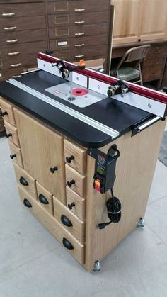 a workbench with drawers and tools on it