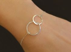 "Double Infinity Circle Bracelet- Available in gold rose gold or 100% sterling silver This simple and beautiful infinity bracelet makes for the perfect keepsake! Available alone or as a set for two - Infinity loop is 24k gold vermeil (sterling silver dipped in 24k gold) or 925 sterling silver - Infinity connector measures about 1\" - Made with a shimmery and lightweight 14k gold fill, sterling, or rose gold fill chain - See sizing instructions and choose your size - Closes with a sturdy 14k gold Gold Infinity Earrings, Eternity Bracelet, Hammered Silver Jewelry, Mother Daughter Bracelets, Infinity Earrings, Sister Bracelet, Sister Jewelry, Infinity Jewelry, Circle Bracelet