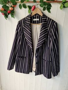 "Stunning tailored style striped blazer in navy and white Very good condition  By:Planet Fully lined Striped boating blazer Size 16 Pit to pit 22\" Waist 20\" Underarm to cuff 17.5\" Length 32\" #boatingblazer #size16blazer #stripedblazer#planetblazer #summerblazer  Great with crisp whites for summer All orders are shipped using biodegradable and recycled packaging where possible  #blazer #stripe #boating #boater #retro #jacket #boyfriend" Elegant Striped Outerwear For Office, Tailored Striped Blazer For Spring, Striped Tailored Blazer With Lapel Collar, Tailored Striped Blazer With Lapel Collar, Striped Fitted Blazer With Lapel Collar, Fitted Striped Blazer With Lapel Collar, Striped Long Sleeve Blazer For Fall, Chic Striped Office Blazer, Striped Single Breasted Blazer For Office