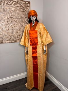 African/Nigeria bubu brocade outfit. One size. Small sized scarf. Oversized,And  Please note measurements: Width: 64inches Lenght: 62inches Long Ceremonial Abaya For Festivals, Ceremonial Long Abaya For Festivals, Ceremonial Long Thobe For Festivals, Traditional Long Kimono In Free Size, Traditional Long Kimono Free Size, Traditional One-size Kimono With Kimono Sleeves, Traditional Long Orange Kimono, Traditional Long Silk Abaya, Traditional Long Kimono For Eid