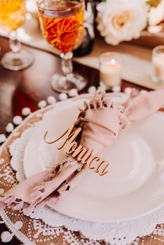 a place setting with napkins and candles