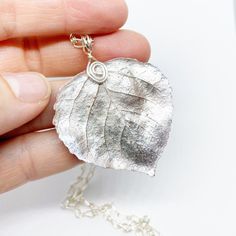 A stunning Colorado Aspen leaf preserved and created into a lovely piece of jewelry to wear all year round.  Each leaf is pressed and painted then sealed in ice resin.  A handmade silver plated bail is secured to the leaf and then hung on a custom length chain.  The chain is handmade from silver plated wire and measures 4mm wide.  You can choose between 16, 18, 20, and 22 inch lengths. * Every leaf is completely unique and can range in sizes of .5 inches to 2 inches.  If you have a preference pl Charoite Necklace, Surfing Board, Grey Pearl Necklace, Aspen Leaf, Ice Resin, Silver Wrap Ring, Nature Necklace, Leaf Jewelry, Gemstone Jewelry Handmade