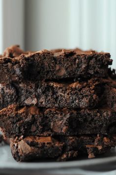 three chocolate brownies stacked on top of each other