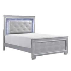 a white bed with an upholstered headboard and foot board is shown against a white background