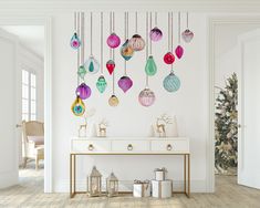 a white room with ornaments hanging from the ceiling