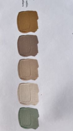 swatches of different shades of paint sitting on top of a piece of white paper