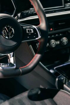 the steering wheel and dashboard of a car