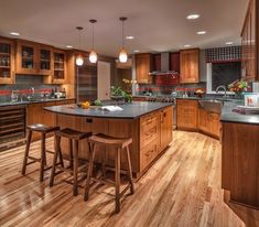 a kitchen with wooden floors and lots of counter space