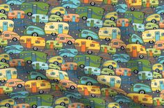 an image of colorful campers on the road