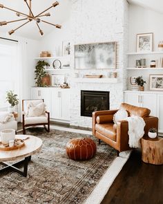 a living room filled with furniture and a fire place