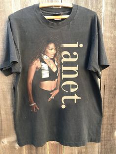 a black t - shirt with an image of a woman on it