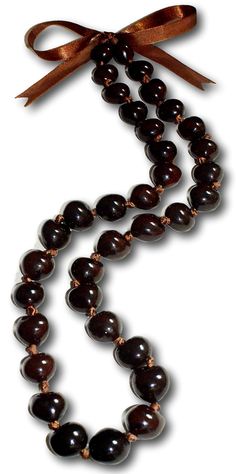 PRICES MAY VARY. 32" inch Mens and Womens Gem Quality Hi-Glossy Genuine Brown Kukui Nuts from the Lumbang Tree Indigenous to the Philippines. Custom Hand Sorted Ideal Select Heart-Shaped Nuts. You Can Determine That These Kukui Nuts are Not Plastic Because each Nut is Unique and Slightly Different. Hand-Crafted in Our Tropical Jewelry Shop by Our Native Island Artisans in the Philippines. American Owned Business Helping Filipino Families. Adjustable Brown Satin Ribbon Tie, Unique Wardrobe Access Kukui Nut Lei, Worry Beads, Tropical Jewelry, Puka Shell Necklace, Kukui Nut, Beach Necklaces, Wardrobe Accessories, Chunky Beads, The Philippines