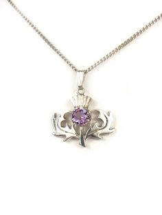 Scottish Thistle Pendant Amethyst Sterling Silver 925 Chain Necklace 18"  Type:  Necklace Stone:  Amethyst Necklace Length: 18" Chain Width:  1.3 mm Pendant Width:  7/8" Height:  n/a Weight:  6.7 gr  Clasp: Spring Ring Signed:  925 Condition: Scattered light scratch to the sterling,  easy to polish up, the clasp is secure, stone is fine Comments: Very well designed, and the chain is above average in design and durability Please see all photos for details Scottish Thistle, Necklace Stone, Amethyst Necklace, Necklace Length, In Design, Stone Necklace, Spring Rings, Silver 925, Favorite Jewelry