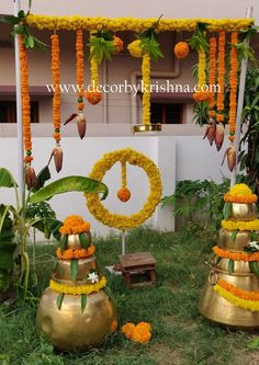 an outdoor decoration with flowers and bells