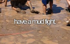 children playing in mud and water at the beach