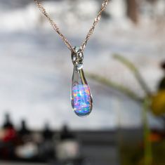 Treat yourself to something pretty today. This pendant features a big sparkly opal that changes all the colors of the rainbow, brightening the day like a big diamond. Shouldn't everyone's day be a little more sparkly? I have made more than one of these so the one you receive will be similar to the one in the picture but not exactly like it.  Approximately 1 inch length. Click here if you'd like a pair of matching earrings: https://www.etsy.com/listing/576129986/blown-glass-earrings-opal-earrings Opal Accessories, Bat Jewelry, Heart Wings, Unique Opal, Mystical Jewelry, Blown Glass Pendant, Heady Glass, Dichroic Glass Pendant, Bubble Necklaces